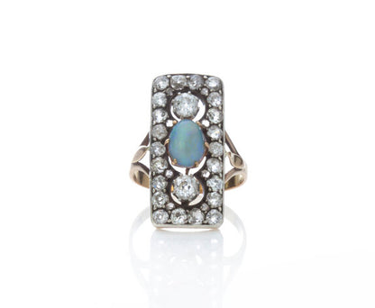 Antique Opal and Old Cut Diamond Panel Ring in 18ct gold; central 1ct cabochon oval opal surrounded by 1.76cts old cut diamonds in an openwork setting