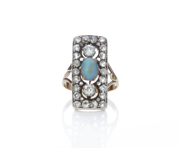 Antique Opal and Old Cut Diamond Panel Ring in 18ct gold; central 1ct cabochon oval opal surrounded by 1.76cts old cut diamonds in an openwork setting