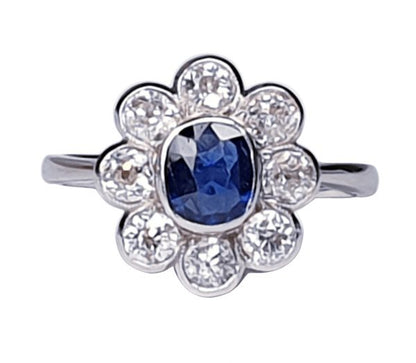 Vintage Sapphire and Old Cut Diamond Flower Cluster Ring; central 0.75 carat natural royal blue sapphire surrounded by 1.40cts old cut diamonds, on a new platinum shank