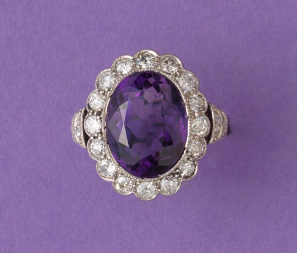 Art Deco Amethyst and Diamond Oval Cluster Ring; large oval faceted amethyst surrounded by 0.50cts old-cut diamonds, pierced white gold mount