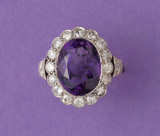 Art Deco Amethyst and Diamond Oval Cluster Ring; large oval faceted amethyst surrounded by 0.50cts old-cut diamonds, pierced white gold mount