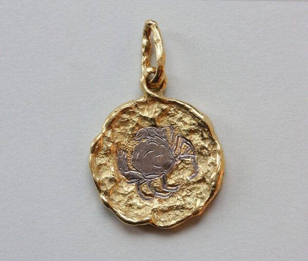Vintage Chaumet 18ct Gold Cancer Horoscope Pendant; with a brutalist textured finish. Signed: Chaumet, Paris, France, circa 1970.
