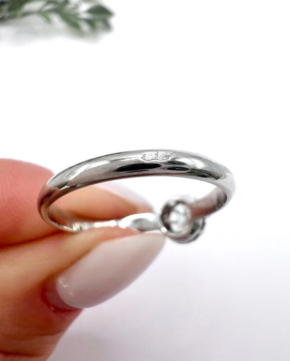 Close-up of French marks on a white gold ring shank