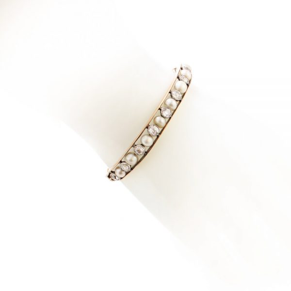 Antique Edwardian Natural Pearl and Old Cut Diamond Bangle Bracelet; set with natural saltwater pearls and 2.75cts old cut diamonds, in 15ct gold and platinum, with GCS certificate