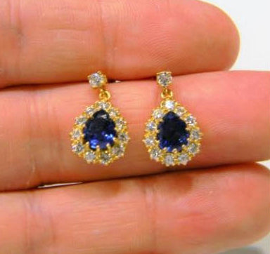 Vintage Sapphire and Diamond Pear Shaped Cluster Drop Earrings; featuring 2.00cts royal blue pear-cut sapphires surrounded by 0.84cts brilliant cut diamonds, with diamond top, in 18ct yellow gold, Circa 1970s