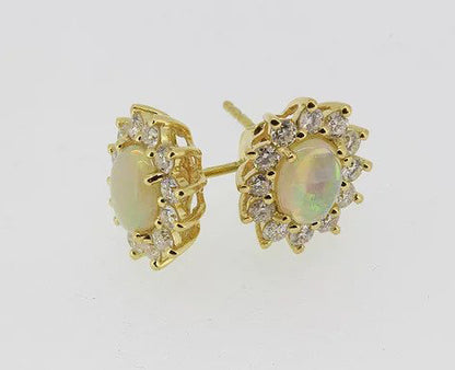 Opal and Diamond Oval Cluster Stud Earrings; featuring oval cabochon opals surrounded by diamonds, claw set, in 18ct yellow gold.