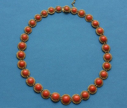 Antique Victorian Coral Riviere Necklace; featuring thirty-one graduated cabochon corals decorated within 14ct yellow gold granulations. Netherlands, 19th century