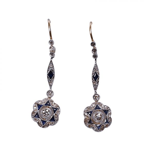 Antique Edwardian Sapphire and Diamond Star Cluster Drop Earrings; featuring sapphires and diamonds arranged in a star cluster pattern suspended from diamond and sapphire set drops, in platinum and 18ct gold