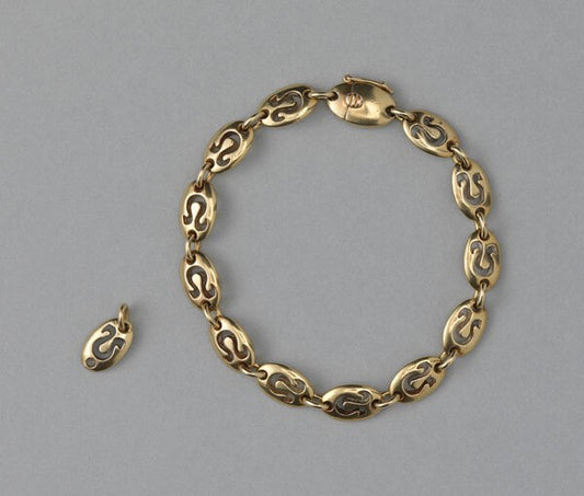 Van Cleef and Arpels Vintage 18ct Yellow Gold Leo Bracelet; chunky oval links with cut out Leo zodiac symbols. Circa 1970. Signed and numbered
