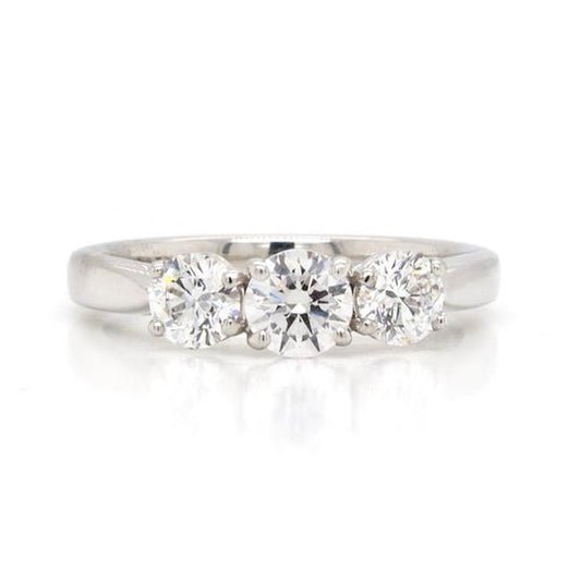 Diamond 1.02ct Three-Stone Ring in Platinum; central 0.40ct round brilliant-cut diamond flanked by smaller diamonds, 1.02ct total, four-claw set, certified