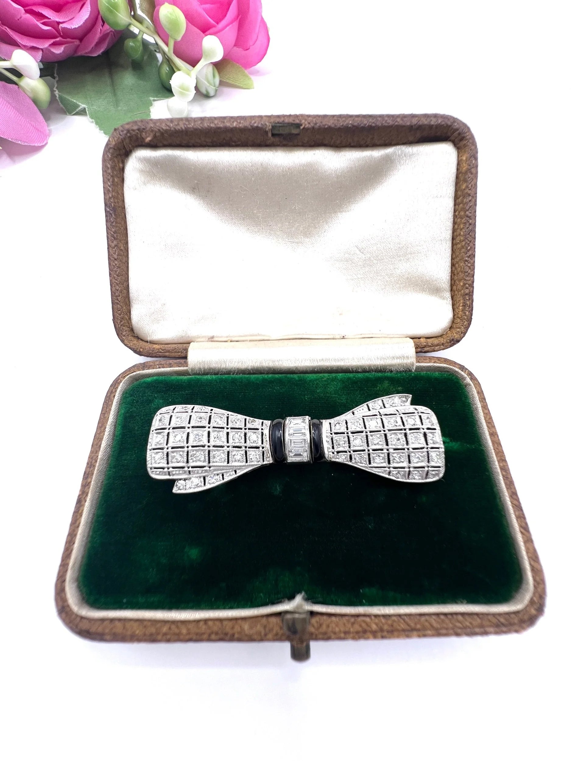 Art Deco 14 Carat White Gold Onyx and Diamond Bow Brooch, Circa 1920