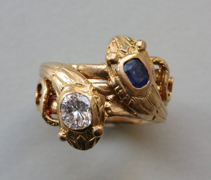 Antique Edwardian Diamond, Sapphire and 18ct Yellow Gold Double Snake Ring; set with a 0.45ct old cut diamond and 0.43ct cushion cut sapphire