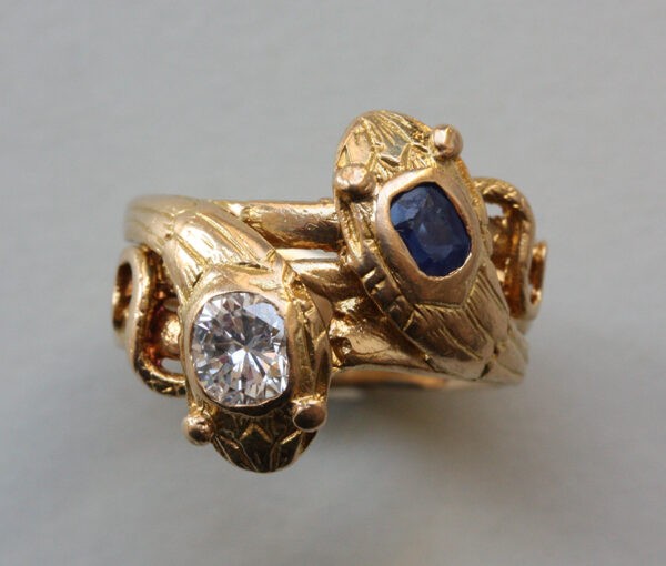 Antique Edwardian Diamond, Sapphire and 18ct Yellow Gold Double Snake Ring; set with a 0.45ct old cut diamond and 0.43ct cushion cut sapphire