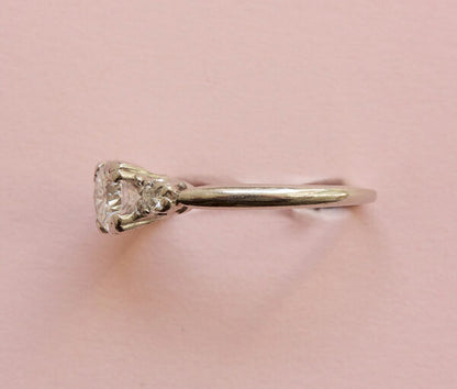 Art Deco 0.75ct Diamond and Platinum Three Stone Ring, 0.75 carat total, colour E/F, heart shaped claws, Signed Caldwell & Co., Circa 1920