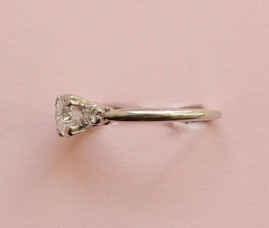 Art Deco 0.75ct Diamond and Platinum Three Stone Ring, 0.75 carat total, colour E/F, heart shaped claws, Signed Caldwell & Co., Circa 1920