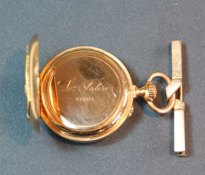 Antique Victorian Clementine Falize's Watch by Jean Daniel Martin et Fils, 18ct yellow and chased gold watch, monogram CF, decorated with holly leaves and berries, white enamel dial. Signed: ‘Len Falize à Paris’ and numbered: 20447. CF are the initials of Clémèntine Falize, Lucien Falize’s wife. Lucien made this watch for her on the occasion of their marriage on 28 April 1871.