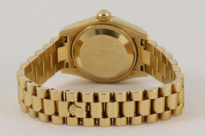 Rolex Lady Datejust 18ct Yellow Gold 179178 Automatic Watch; white dial, Roman numerals, date indicator and sapphire crystal, 18ct yellow gold President bracelet with 18ct yellow gold Crownclasp, with Rolex box and papers.