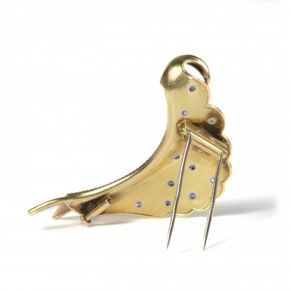 Cartier Vintage Sapphire Diamond and Gold Brooch; stylised folded leaf decorated with gold studs, brilliant diamonds and sapphires, Circa 1960