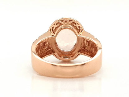 2.54ct Oval Morganite and Diamond Cluster Dress Ring in 18ct Rose Gold; central 2.54 carat oval faceted morganite accented with a double diamond surround and diamond set geometric pierced shoulders
