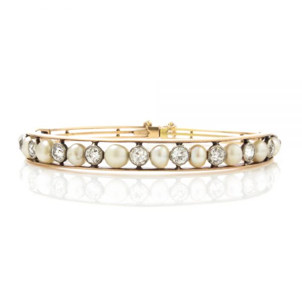 Antique Edwardian Natural Pearl and Old Cut Diamond Bangle Bracelet; set with natural saltwater pearls and 2.75cts old cut diamonds, in 15ct gold and platinum, with GCS certificate