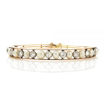 Antique Edwardian Natural Pearl and Old Cut Diamond Bangle Bracelet; set with natural saltwater pearls and 2.75cts old cut diamonds, in 15ct gold and platinum, with GCS certificate