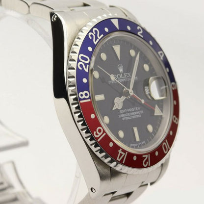 Rolex GMT Master 16700 Stainless Steel 40mm Automatic Watch, black dial, Pepsi red and blue rotating bezel, 24 hour hand, date indicator and sapphire crystal. Stainless steel Oyster bracelet. With Rolex box and papers. Purchased in 1996.