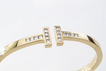 Tiffany and Co 18ct Gold Bangle with 1.60cts Princess Cut Diamonds