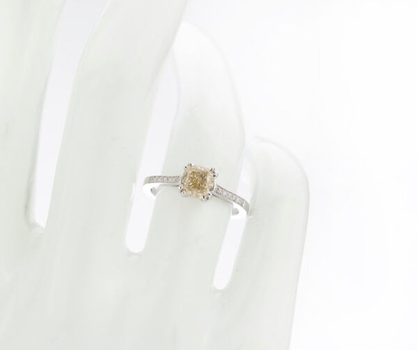 Cushion Cut Fancy Yellow Diamond Engagement Ring, 1.24 carats, diamond set shoulders, with certificate. Circa 1990s.