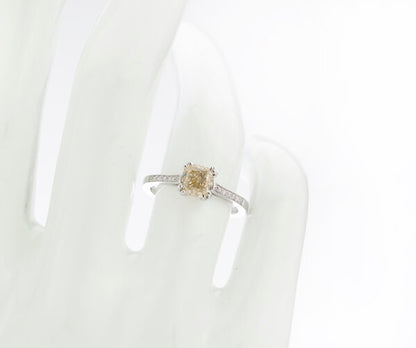 Cushion Cut Fancy Yellow Diamond Engagement Ring, 1.24 carats, diamond set shoulders, with certificate. Circa 1990s.