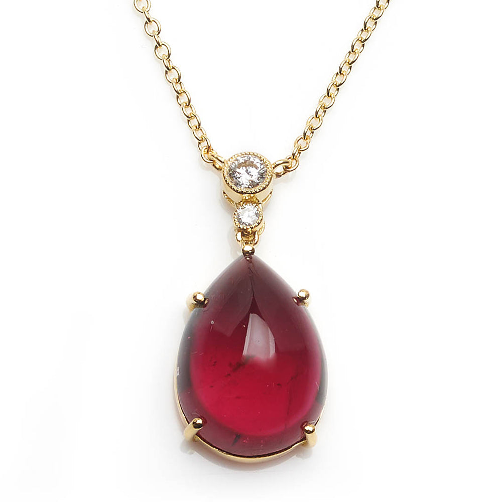 Diamond topped tourmaline pendant with a gold trace chain.
