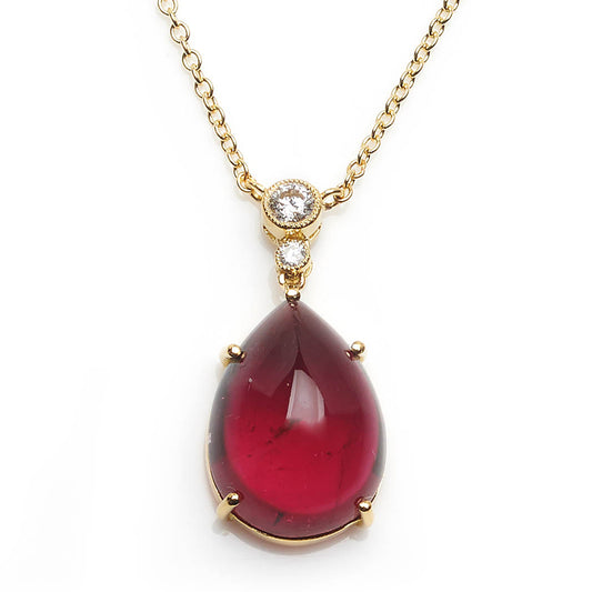Diamond topped tourmaline pendant with a gold trace chain.