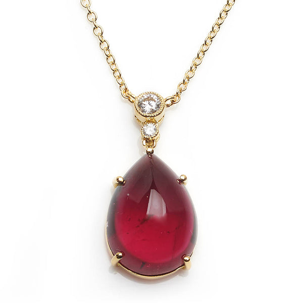 Diamond topped tourmaline pendant with a gold trace chain.