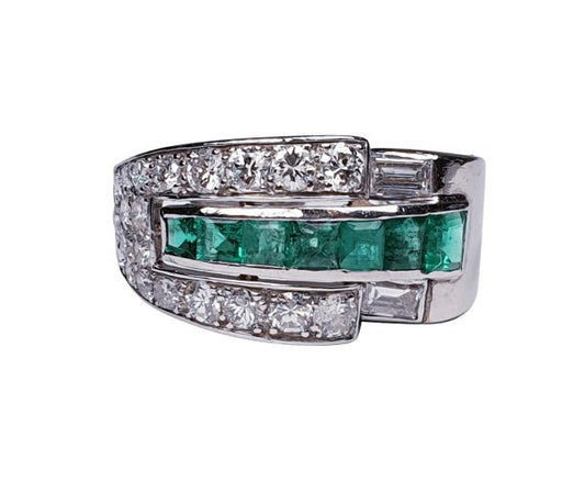 Vintage Emerald and Diamond Asymmetric Geometric Band Ring; set with 0.70cts graduated square step-cut emeralds encompassed by an asymmetric 1.40cts diamond surround. Mounted in Platinum and 18ct White Gold. Circa 1940s