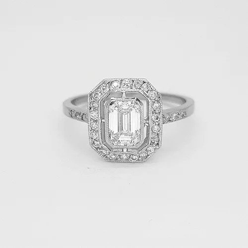 Emerald Cut Diamond Cluster Ring in 18ct White Gold; central 0.75ct emerald-cut diamond surrounded by 0.25ct diamond border and diamond set shoulders, 1.00 carat total