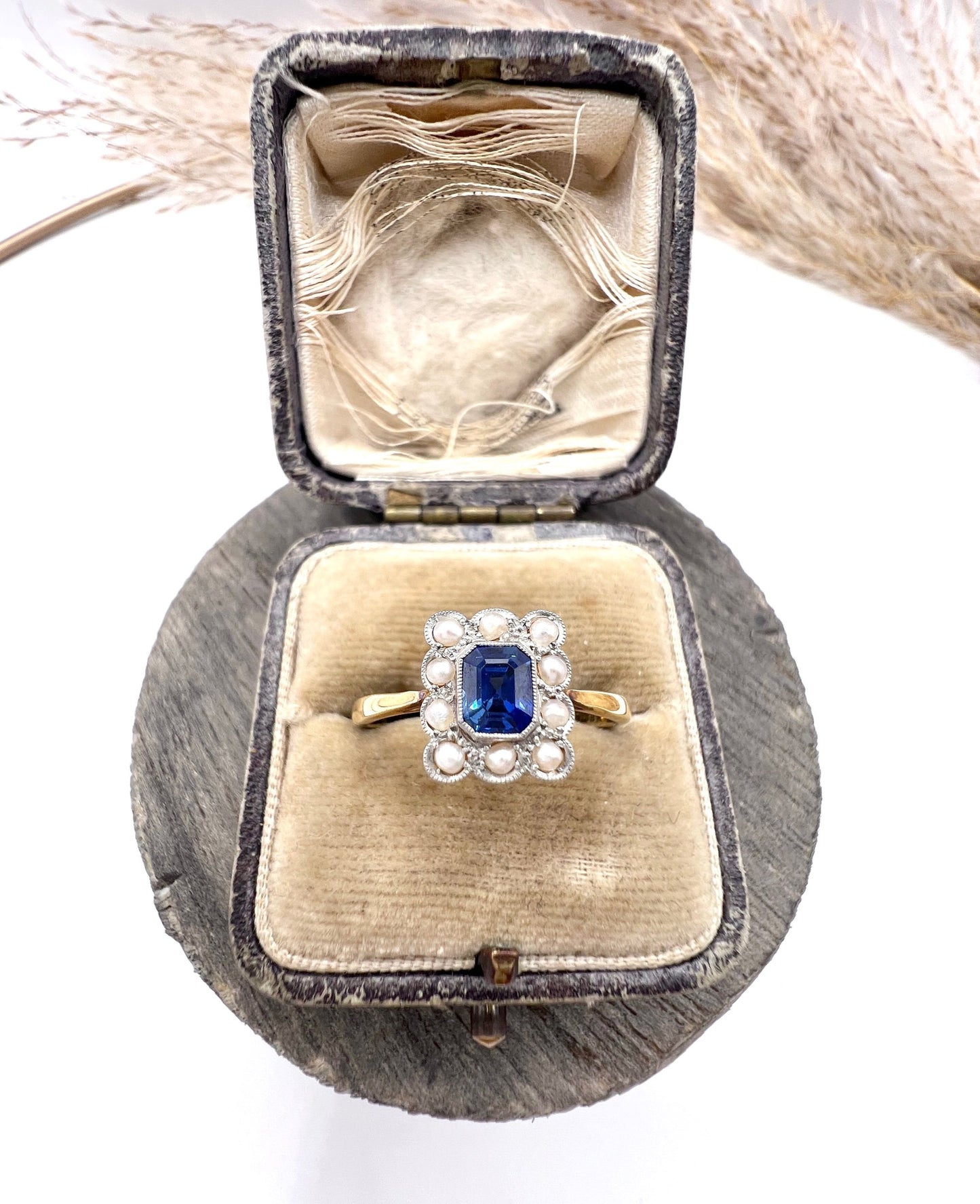 A sapphire and pearl cluster ring in yellow gold and platinum, in an antique ring box