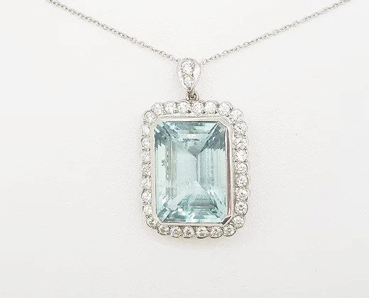 Aquamarine and Diamond Cluster Pendant; 15.00 carat emerald-cut aquamarine with 1.25ct brilliant-cut diamond border, diamond set bale, with chain