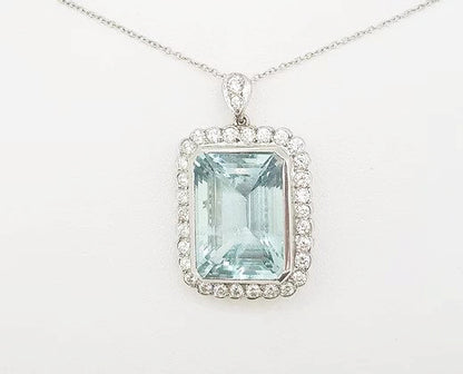 Aquamarine and Diamond Cluster Pendant; 15.00 carat emerald-cut aquamarine with 1.25ct brilliant-cut diamond border, diamond set bale, with chain