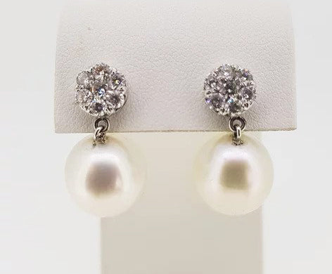 South Sea Pearl and Diamond Cluster Drop Earrings; 13.5mm South Sea pearls suspended from 0.80cts circular diamond clusters, 18ct white gold