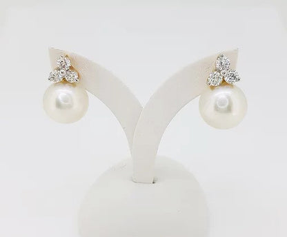 South Sea Pearl and Diamond Earrings; 12.5mm white South Sea pearl, with a diamond trefoil top, 1.20 carat total, set in 18ct yellow gold
