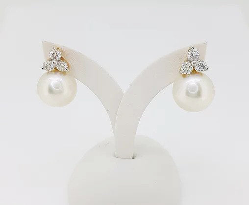 South Sea Pearl and Diamond Earrings; 12.5mm white South Sea pearl, with a diamond trefoil top, 1.20 carat total, set in 18ct yellow gold