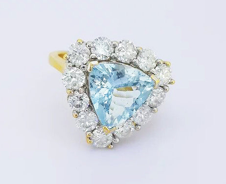 Aquamarine and Diamond Triangular Cluster Ring; 2.00ct triangle-shaped aquamarine set with a surround of 1.50cts brilliant cut diamonds, 18ct yellow gold.