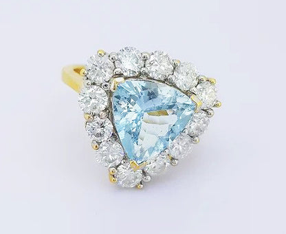 Aquamarine and Diamond Triangular Cluster Ring; 2.00ct triangle-shaped aquamarine set with a surround of 1.50cts brilliant cut diamonds, 18ct yellow gold.