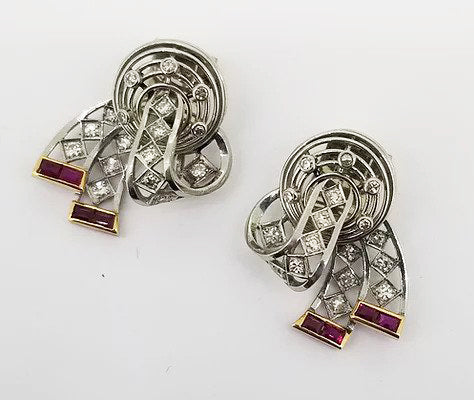 Vintage Diamond, Platinum and Ruby Clip On Earrings, openwork bow design, set with diamonds throughout and accented with rubies. Circa 1940.