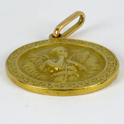 French Cupid and Lovebirds 18ct Yellow Gold Charm Pendant; depicting a thoughtful cupid with bow and arrow to one side, with a pair of lovebirds on a rose branch within a frame of ivy to the reverse, Signed L. Tricard