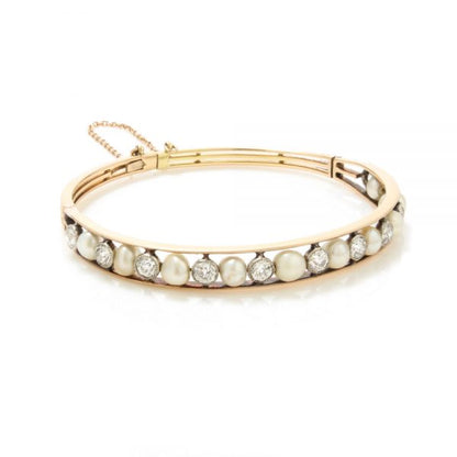 Antique Edwardian Natural Pearl and Old Cut Diamond Bangle Bracelet; set with natural saltwater pearls and 2.75cts old cut diamonds, in 15ct gold and platinum, with GCS certificate