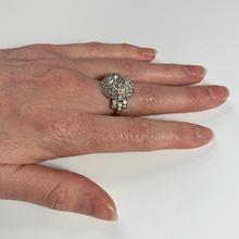 Art Deco French 3.60ct Diamond and Platinum Target Dome Bombe Ring; central 0.50ct round brilliant cut diamond surrounded with 48 brilliant diamonds and diamond set shoulders, 3.60 carat total