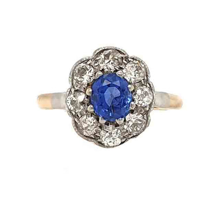Antique Ceylon Sapphire and Old Cut Diamond Cluster Ring; 0.80ct oval cornflour blue sapphire surrounded by 0.80cts old mine cut diamonds, in platinum and 18ct yellow gold, Circa 1900