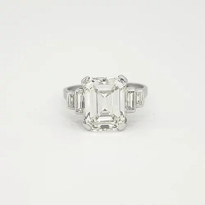 Art Deco Asscher Cut Diamond and Platinum Ring; central 4ct asscher cut diamond, estimated colour I/J and clarity VS2. Accented by two graduated baguette cut diamonds to each side