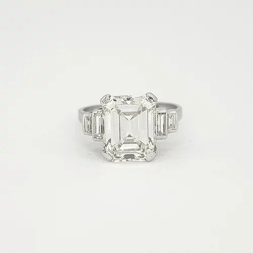 Art Deco Asscher Cut Diamond and Platinum Ring; central 4ct asscher cut diamond, estimated colour I/J and clarity VS2. Accented by two graduated baguette cut diamonds to each side
