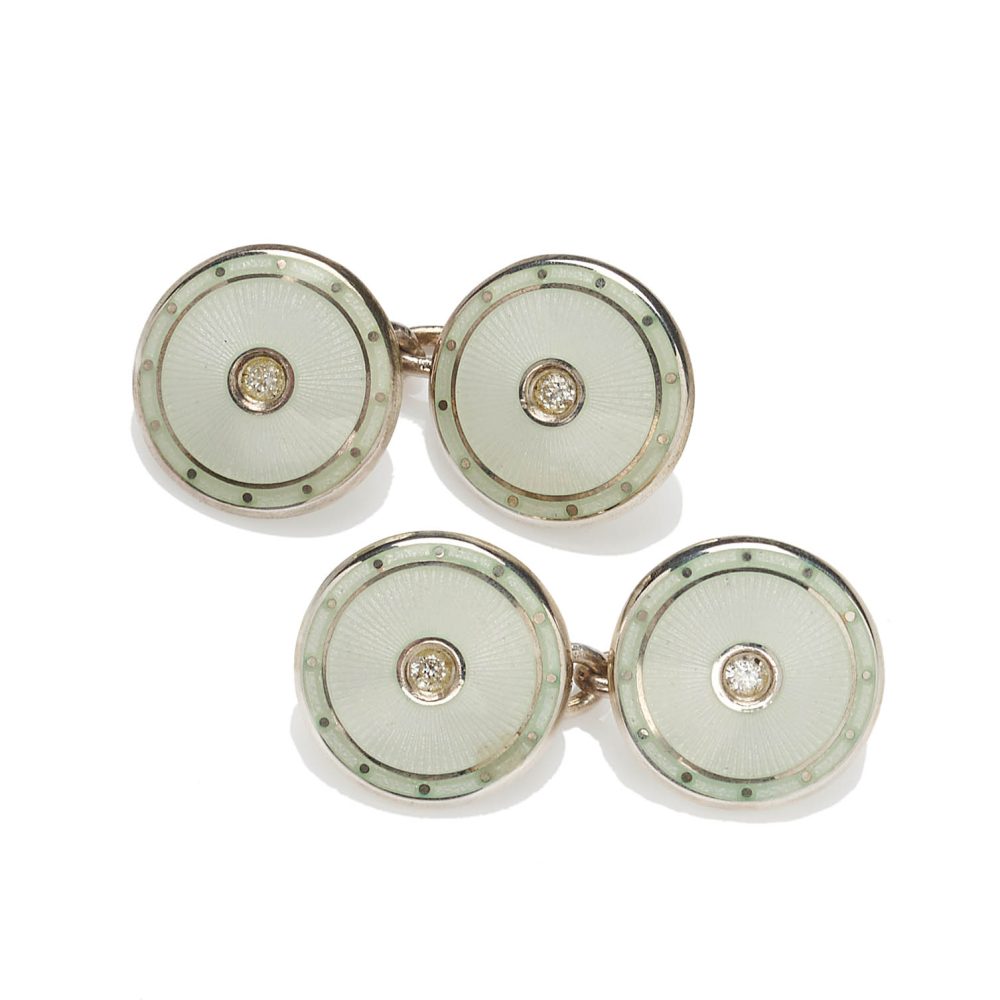 Pair of double sided guilloché enamel silver cufflinks in ivory, each face set with a brilliant cut diamond.